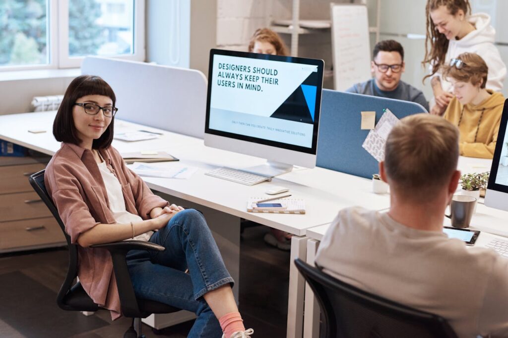 People inside an office working on a project on the computer.