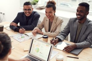 Two black business men and a black business woman at a conference table. Image for ResultsResourcing free quiz to identify your business persona.