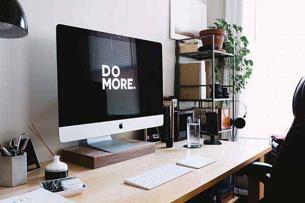 A photo of a computer on a desk that highlights the shift occurring in the workforce from traditional teams to a virtual environment. 