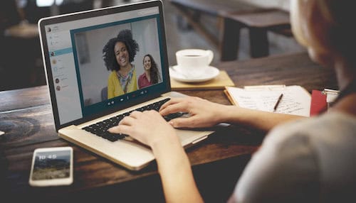 A photo of three women communicating through an online conference line suggesting the benefits of virtual talent and using freelancers or contractors on a virtual team. 