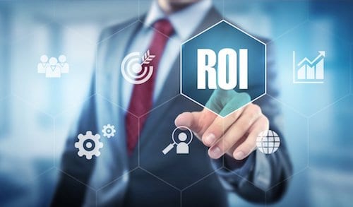 A business person points to the word ROI suggesting that a nimble hiring strategy and recruitment strategy that utilizes freelance workers and contract resources helped him boost profitability. 