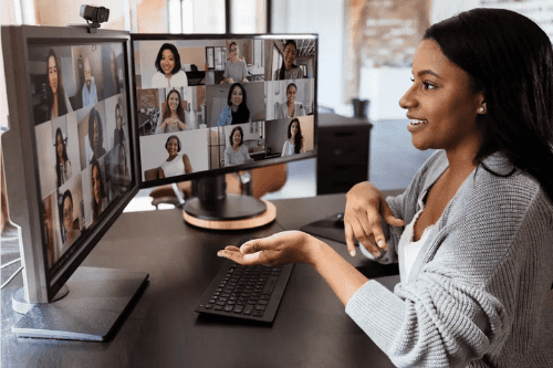 Freelance remote worker connecting with a virtual team via a virtual meeting room.