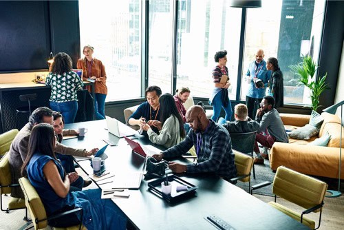 An image of different people coworking together in a single space suggests this could be a new way of working.