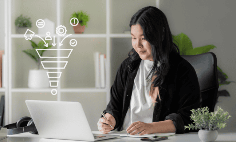 A lead generation Virtual Assistant working on a computer. Outsourced lead generation support
