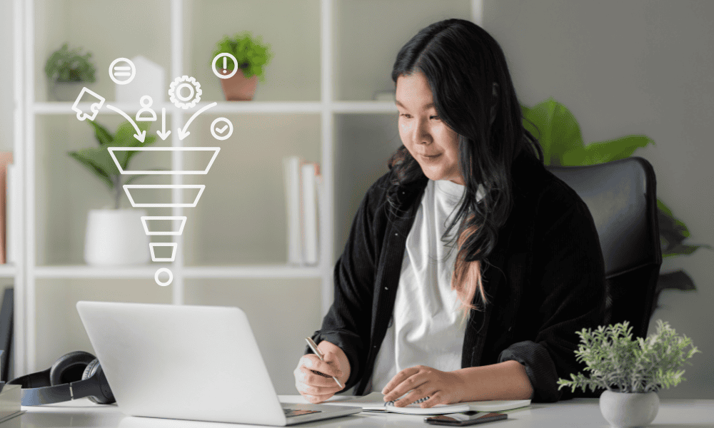 A lead generation Virtual Assistant working on a computer. Outsourced lead generation support